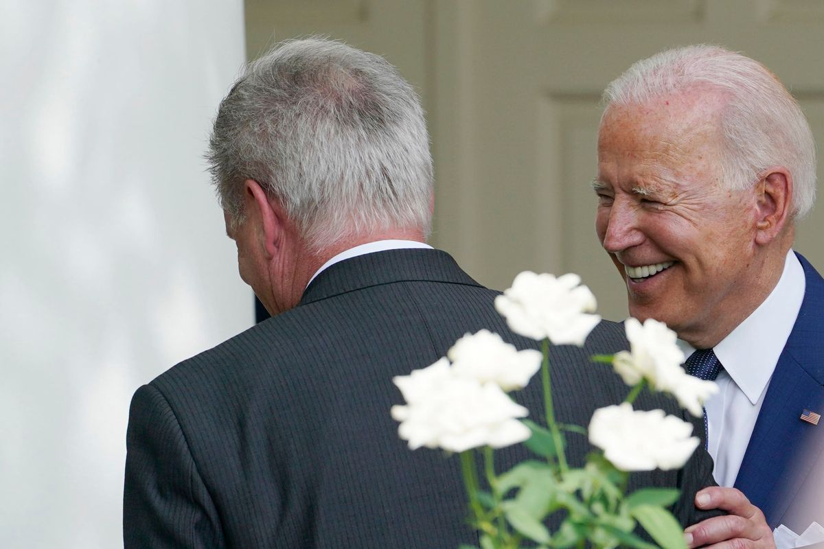 President Biden talks with House Minority Leader Kevin McCarthy of California after an event in the Rose Garden of the White House on July 26, 2021. (Susan Walsh/AP)