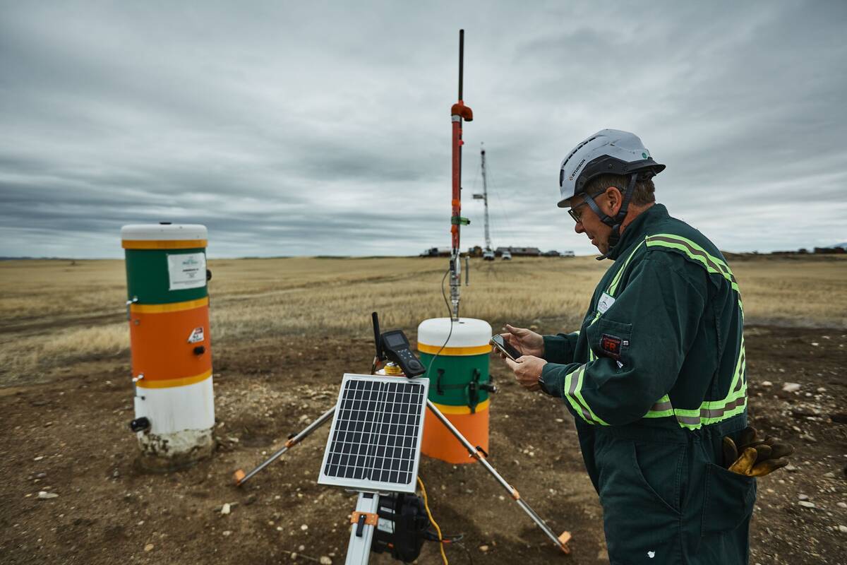 Curtis Shuck, founder of the Well Done Foundation, an organization that caps abandoned oil and gas wells, checks measurements near Shelby, Mont. (Adrián Sánchez-Gonzalez for The Washington Post)