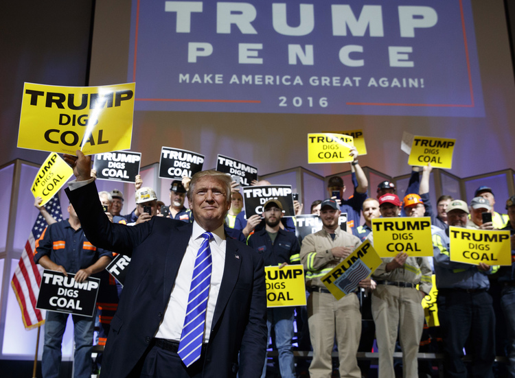 Donald Trump holds a sign during a rally yesterday&nbsp;in Abingdon, Va. (Evan Vucci/AP)</p>  