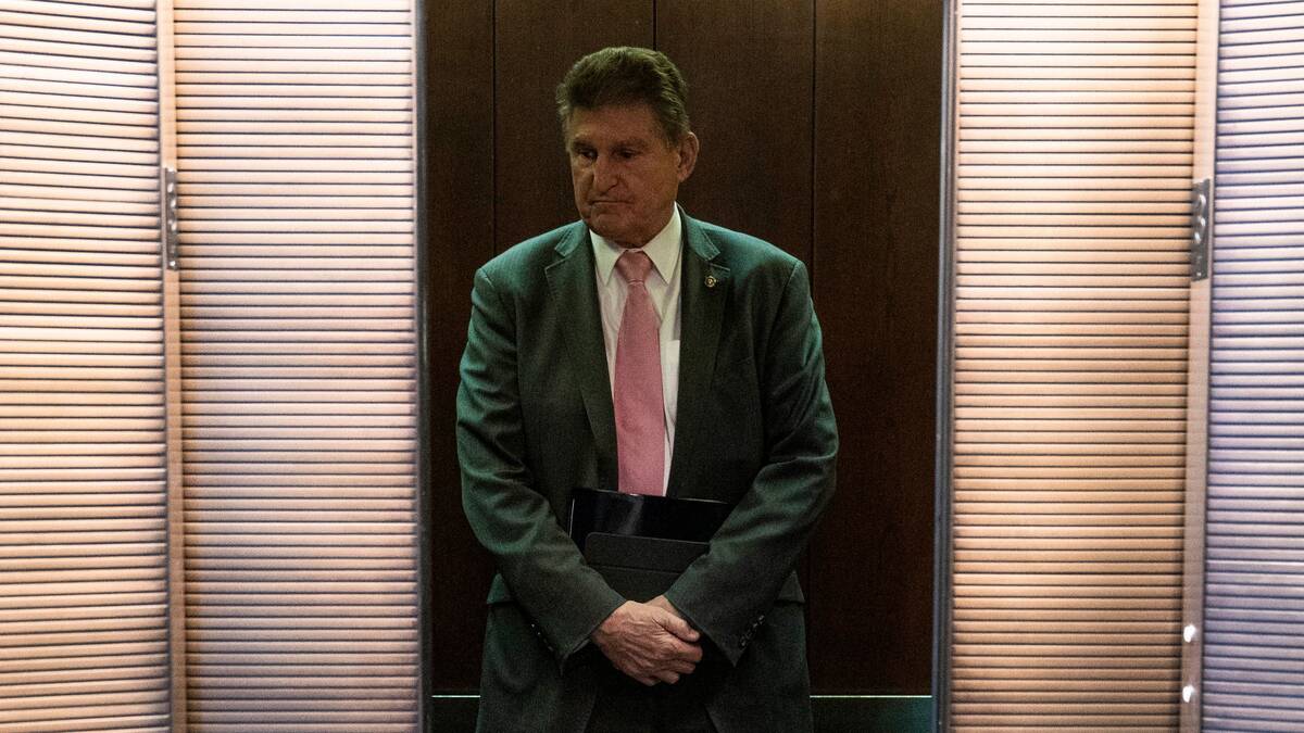 Sen. Joe Manchin III (D-W.Va.) leaves his Capitol Hill office on Jan. 20. (Sarah Silbiger for The Washington Post)