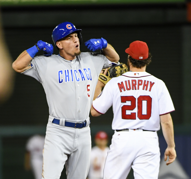 Chicago Cubs left fielder Albert Almora Jr. flexes toward his dugout after delivering the decisive hit in the ninth inning in a 4-3 win over the Nationals last night. (Jonathan Newton/The Washington Post)</p>  