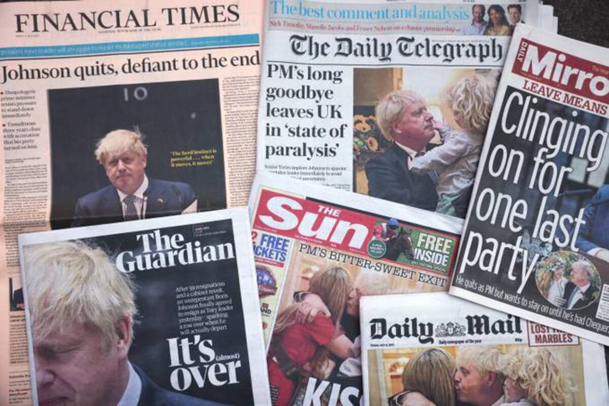 A photo illustration of British newspaper front pages following the resignation speech by Boris Johnson, on Thursday. (Dan Kitwood/Getty Images)