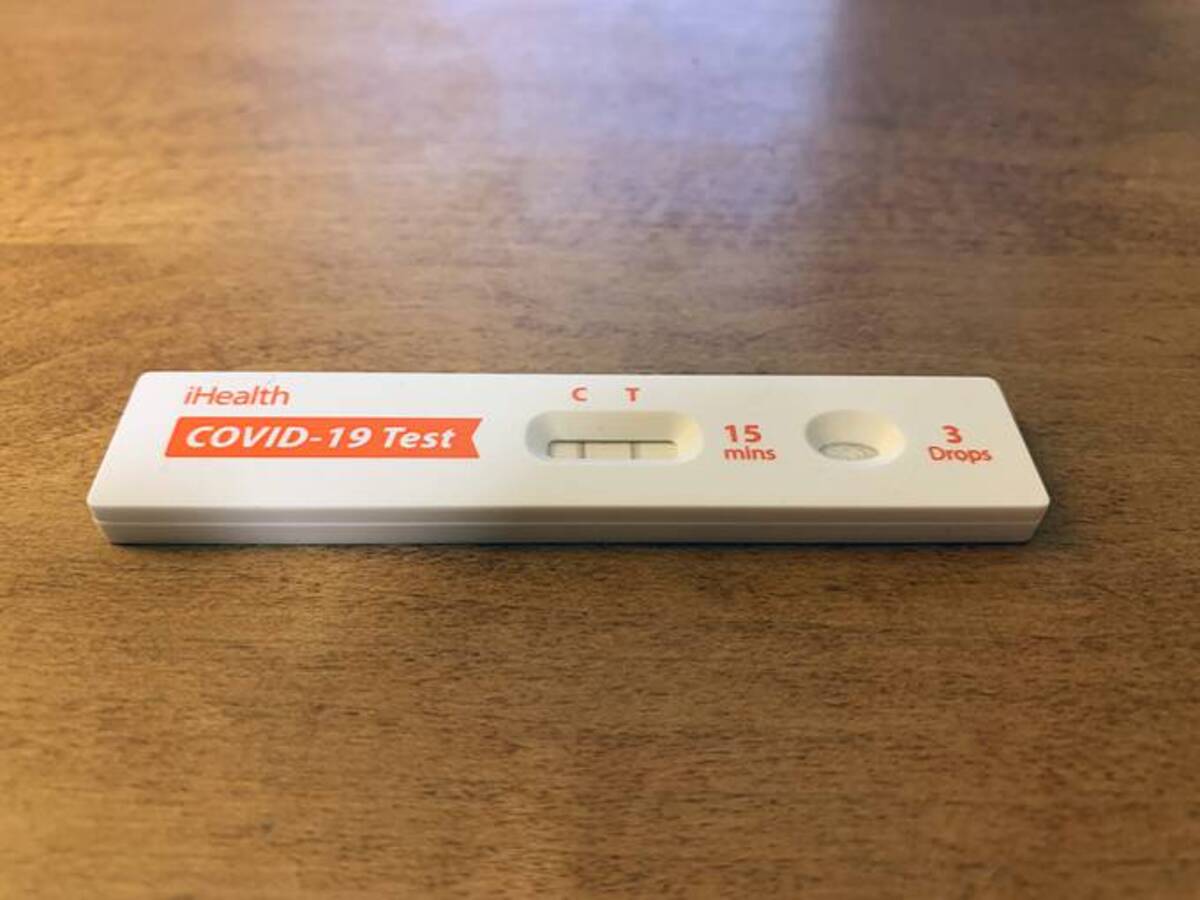 A positive coronavirus rapid test taken at home during January 2022. (Bronwen Latimer/The Washington Post)