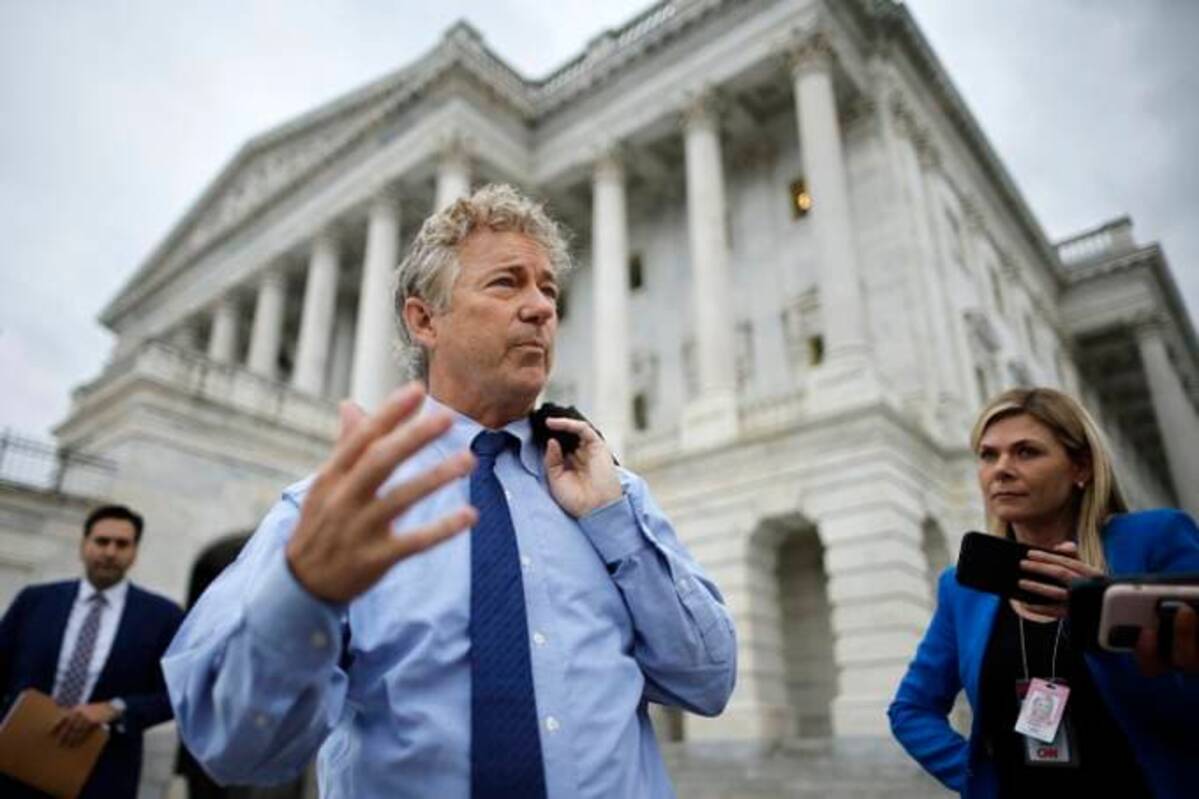 Sen. Rand Paul (R-Ky.) talks with journalists as he leaves the U.S. Capitol on June 23. (Chip Somodevilla/Getty Images)