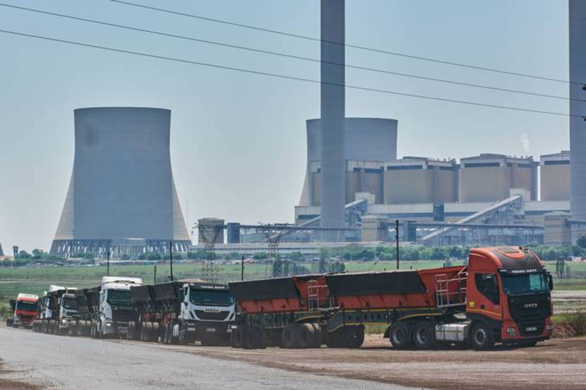 Coal delivery trucks outside a power station in South Africa on Oct. 15. (Waldo Swiegers/ Bloomberg News)&nbsp;