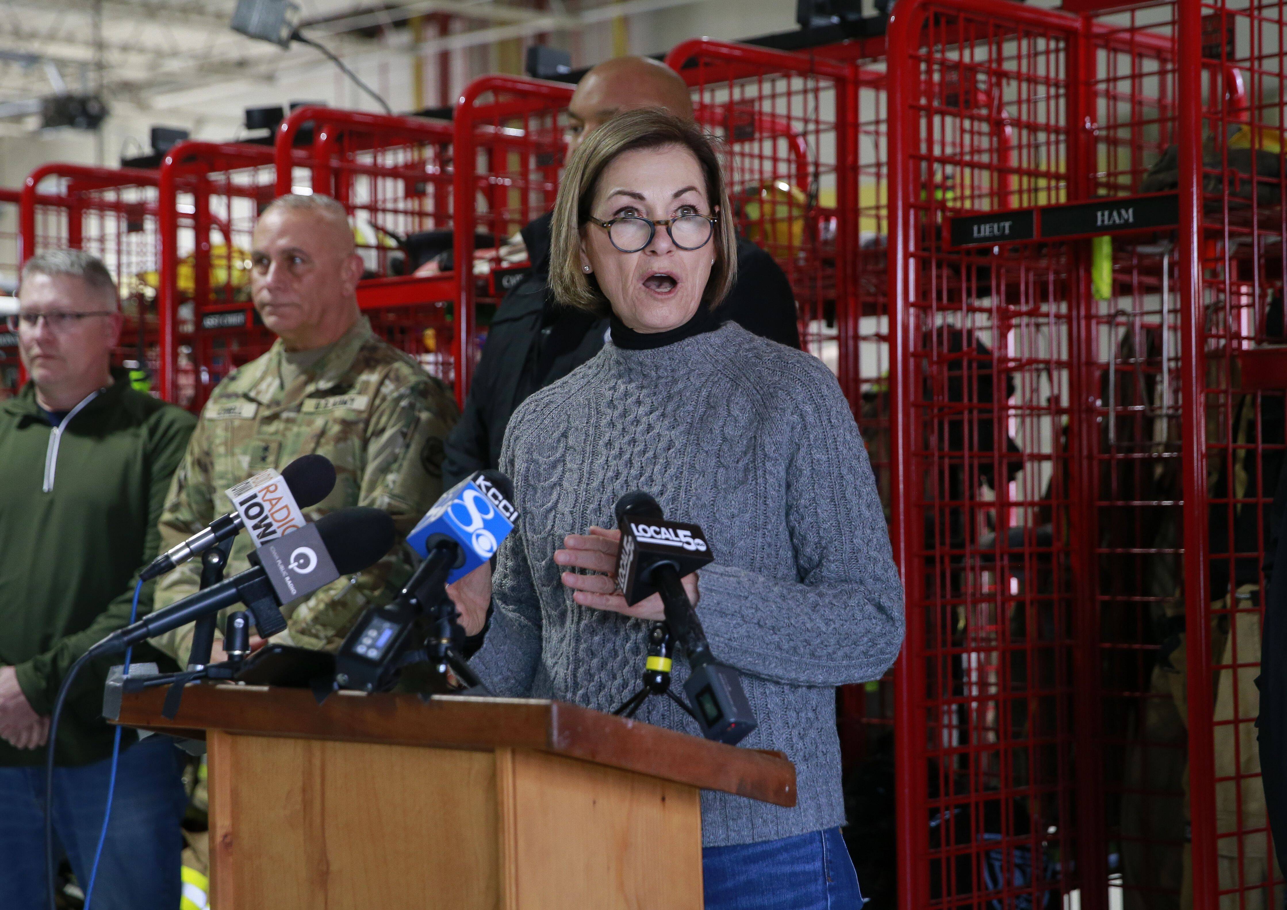 Iowa Gov. Kim Reynolds (R) updates the media after touring tornado-damaged parts of Winterset, Iowa, on Sunday. (Bryon Houlgrave/The Des Moines Register via AP)