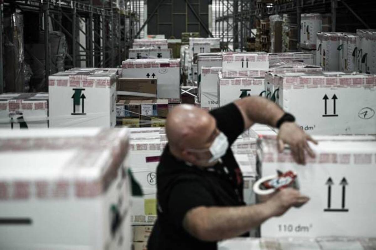 An employee of Doctors Without Borders prepares boxes of supplies for the first shipment of medical equipment for teams in Poland and Moldova to be sent to Ukraine. (Philippe Lopez/AFP/Getty Images)
