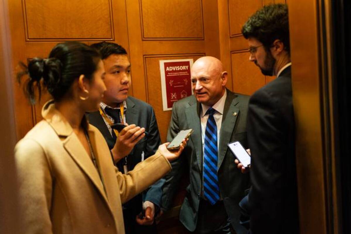 Sen. Mark Kelly (D-Ariz.) speaks to members of the media at the U.S. Capitol on Tuesday. (Eric Lee/Bloomberg News)