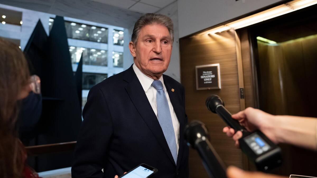Sen. Joe Manchin III (D-W.Va.) leaves his office Dec. 13 after speaking with the president. (J. Scott Applewhite/AP)