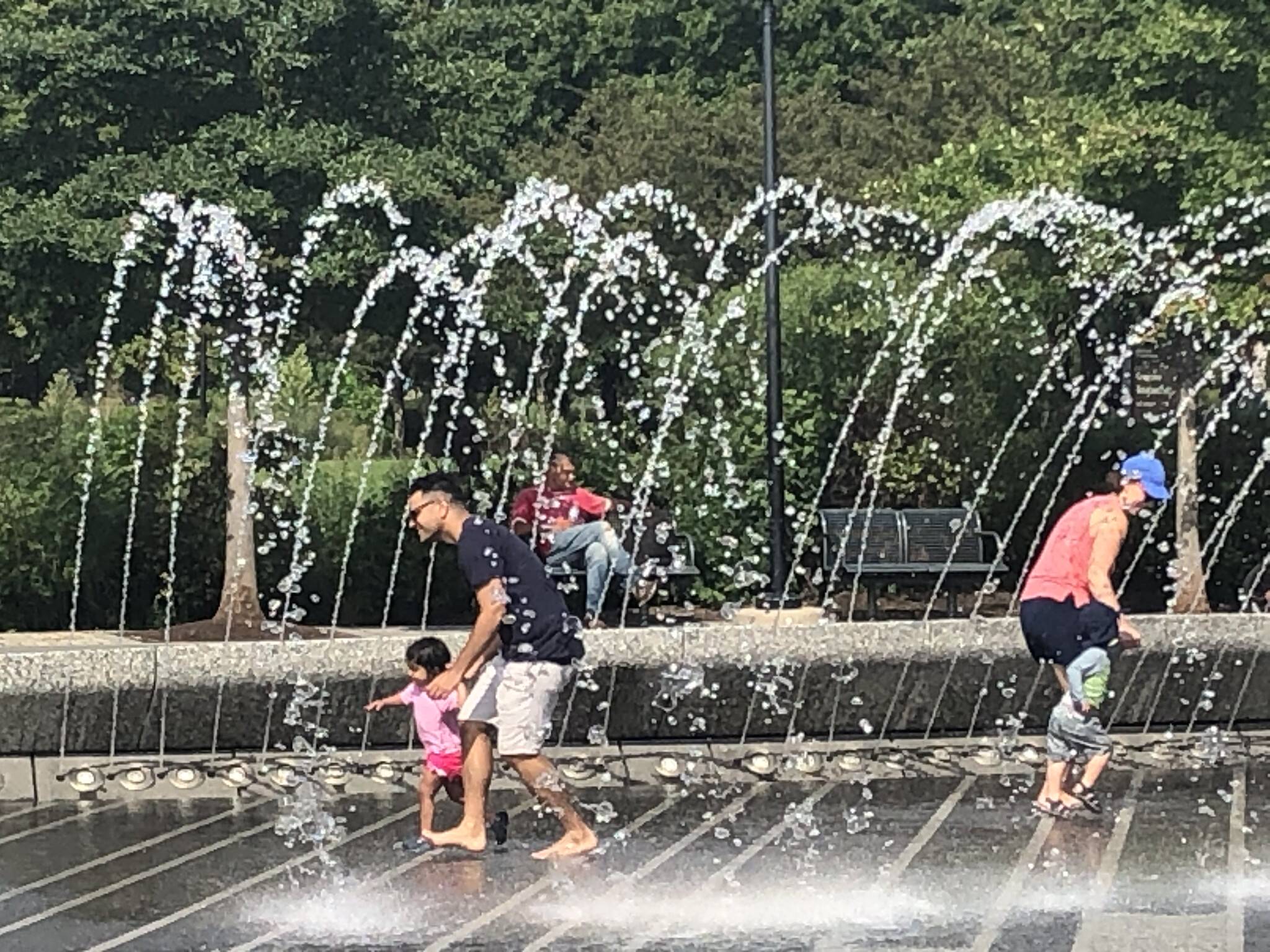 Keeping cool in the fountain at Georgetown Waterfront Park. (Jeannie in D.C./Flickr)