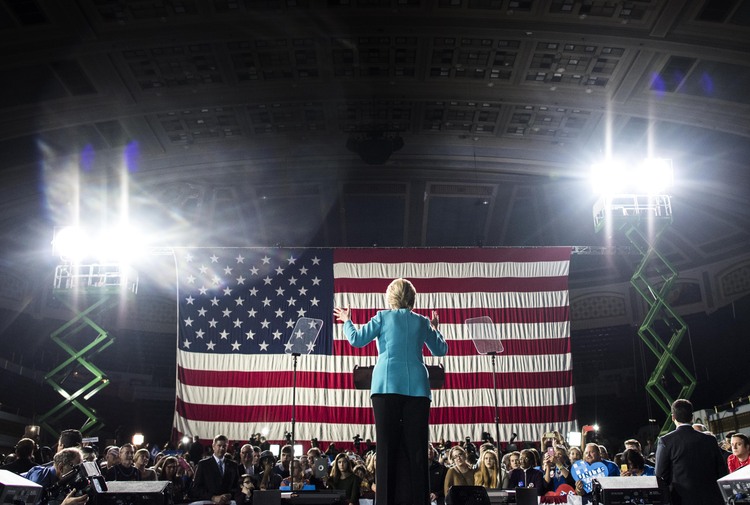 Clinton, accompanied by basketball star Lebron James, speaks to Ohio voters during a campaign rally in Cleveland. (Melina Mara/The Washington Post)</p>  