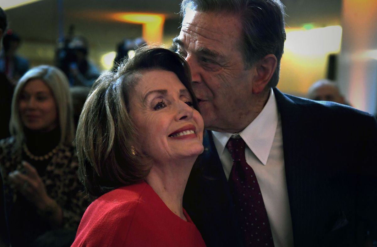 Nancy Pelosi receives a kiss from her husband Paul Pelosi after a donation ceremony on March 7, 2018. (Michael S. Williamson/The Washington Post)