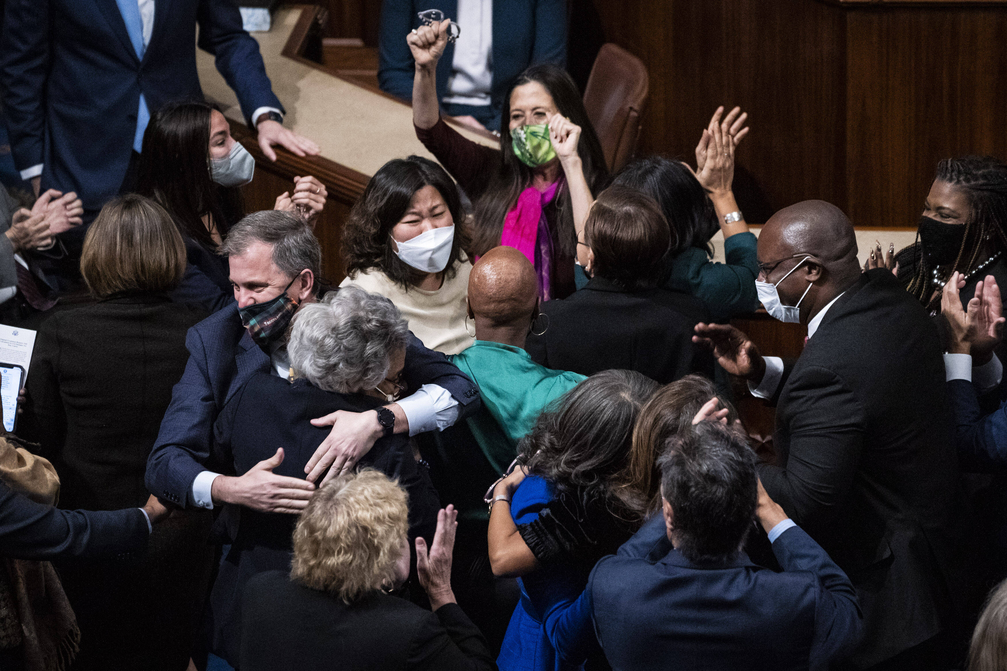 House Democrats celebrate Friday. (Jabin Botsford/The Washington Post)
