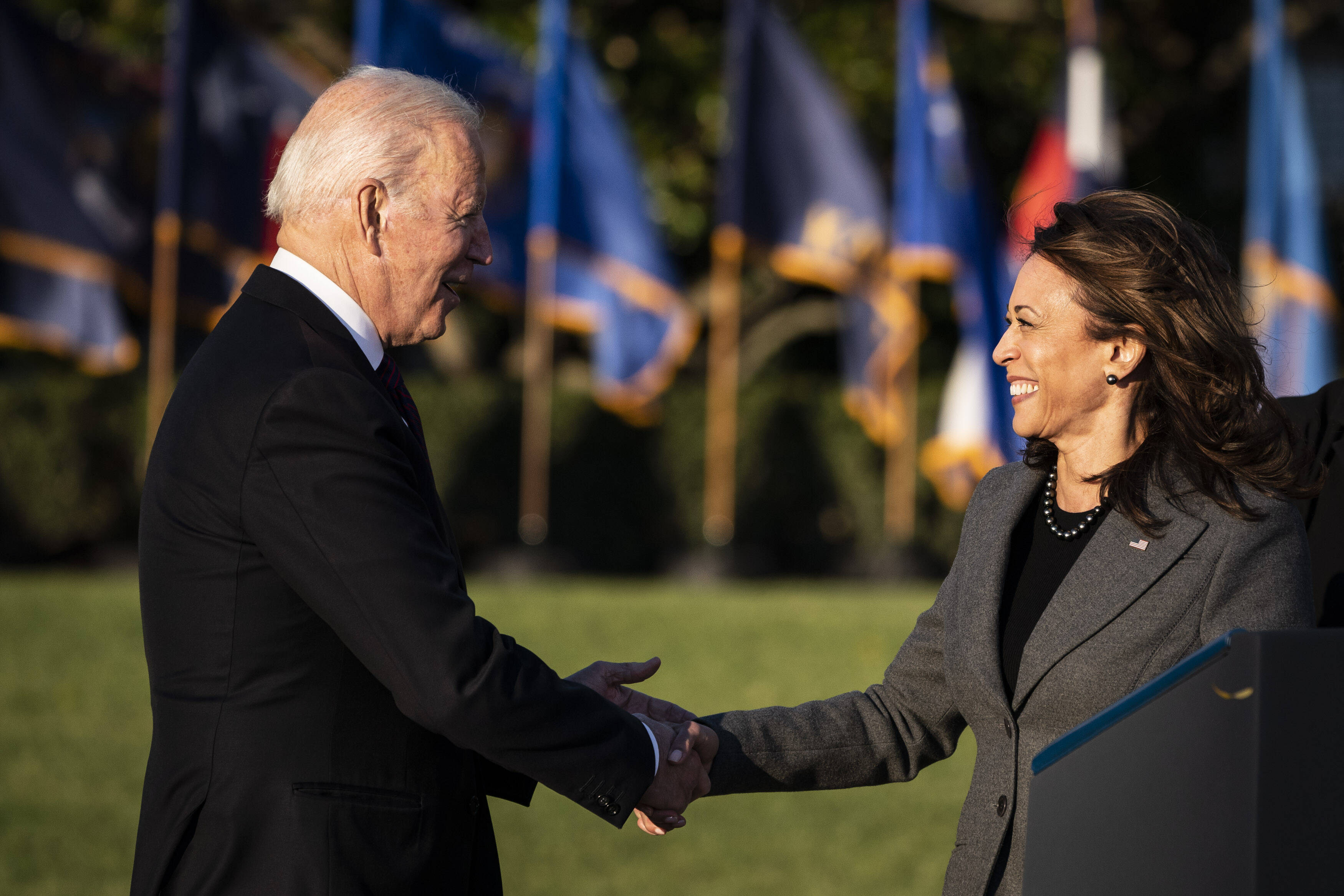 President Biden greets Vice President Harris on Monday before celebrating the signing of the infrastructure package.
