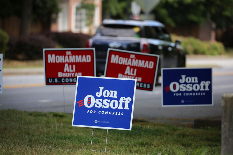 Campaign signs on a road in Atlanta ahead of Tuesday's special election in Georgia's Sixth Congressional District. (Joe Raedle/Getty Images)</p>  