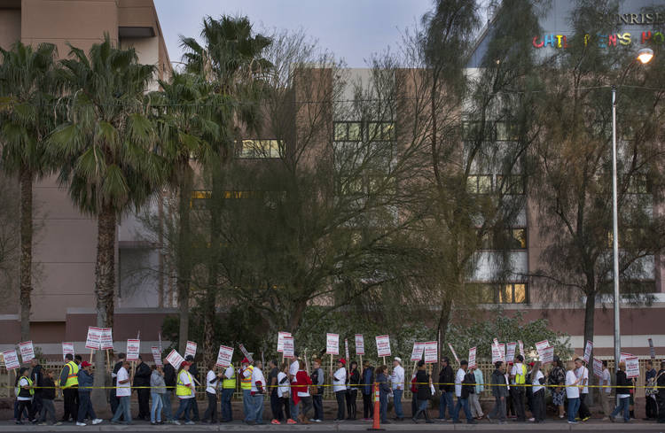 Scores of Culinary Workers Union members picket outside Sunrise Hospital in Las Vegas just before the presidential caucuses got underway on Feb. 18, 2016. (Linda Davidson/The Washington Post)  