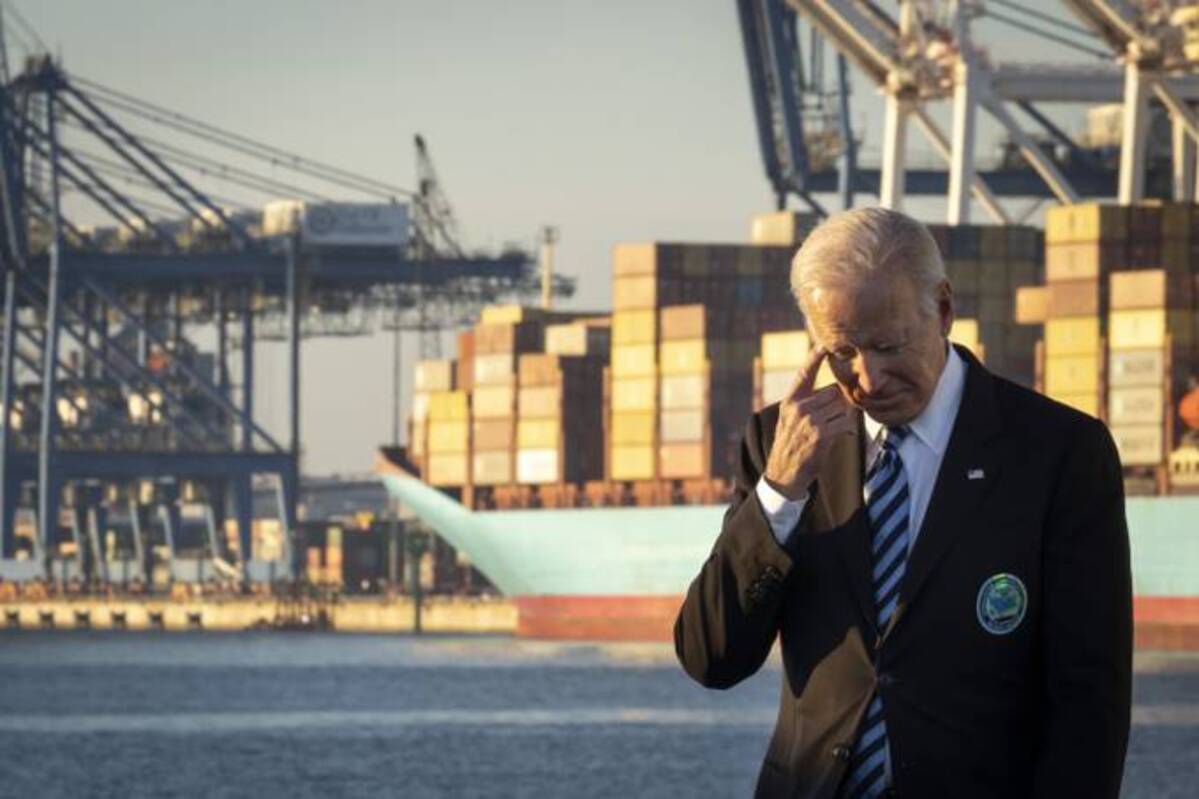 President Biden waits to speak about the recently passed $1.2 trillion Infrastructure Investment and Jobs Act at the Port of Baltimore on Wednesday. (Drew Angerer/Getty Images)