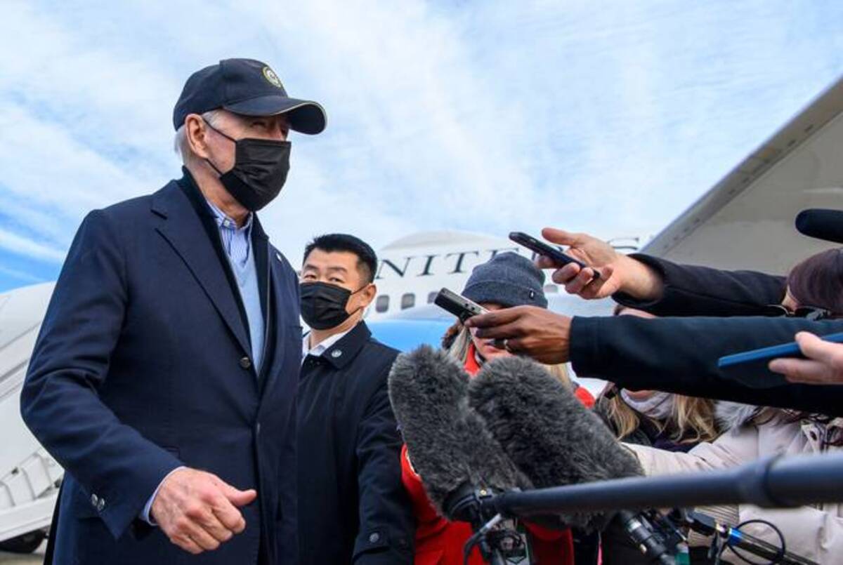 President Biden walks to his limousine after answering reporters question upon arrival at Andrews Air Force Base in Maryland on Sunday. (Mandel Mgan/AFP via Getty Images)