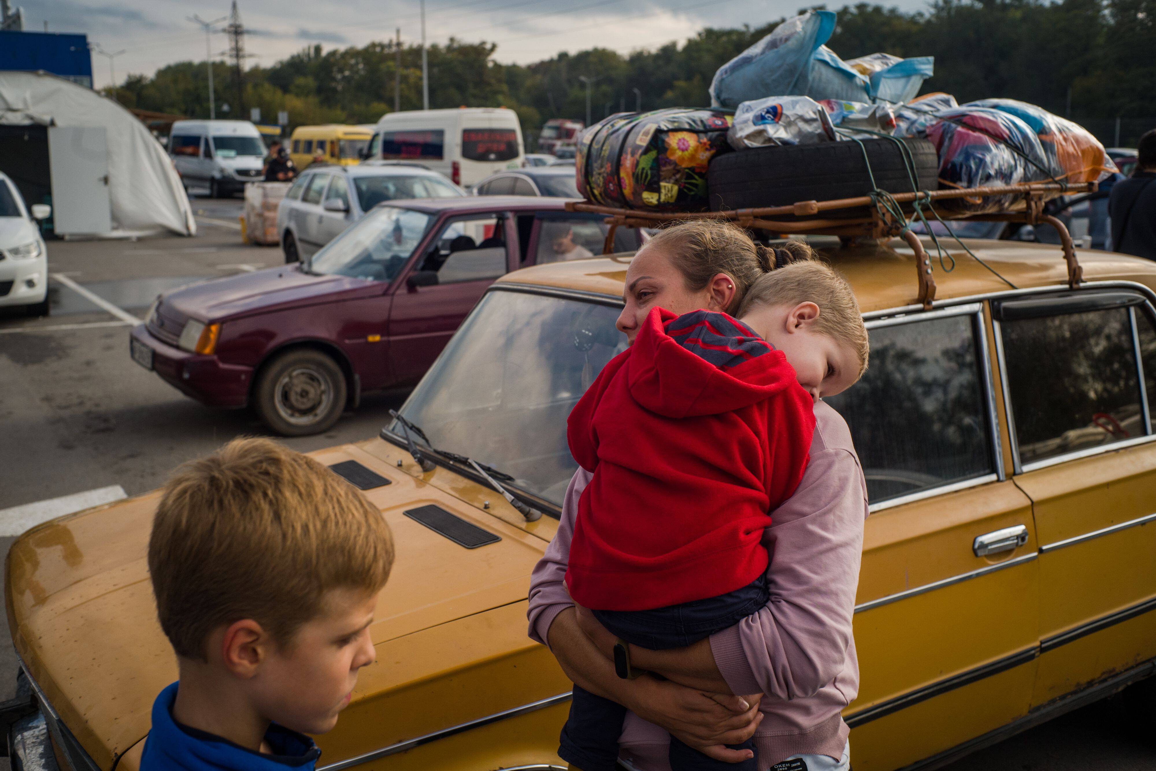 Victoria, Gleb, and Arseni, a family from Berdyansk, who left their home in the occupied territories in fear of the annexation referendum, on Sept. 28. (Wojciech Grzedzinski for The Washington Post)