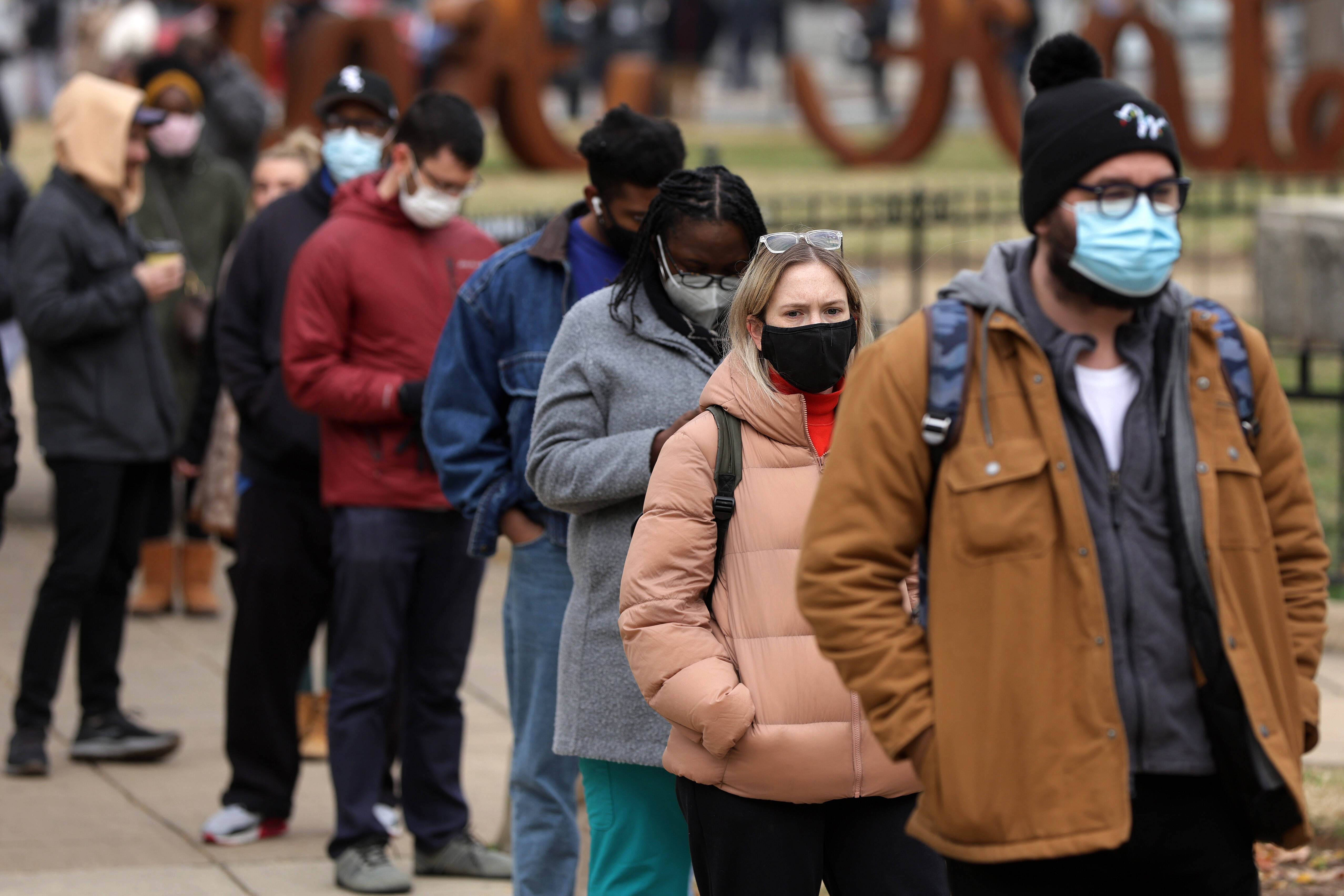 People wait in line for coronavirus tests in Washington on Tuesday. (Alex Wong/Getty Images)