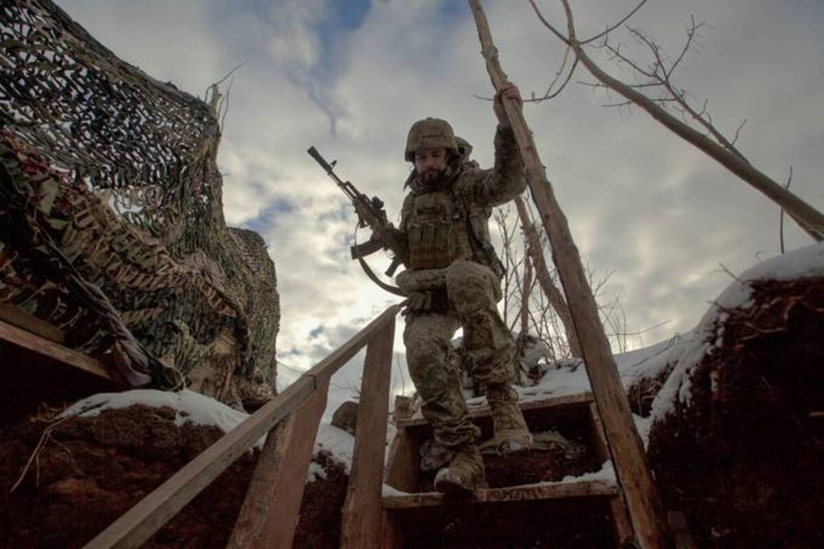 A service member of the Ukrainian armed forces walks at combat positions near the line of separation from Russian-backed rebels near Horlivka in the Donetsk region, Ukraine. (Anna Kudriavtseva/Reuters)