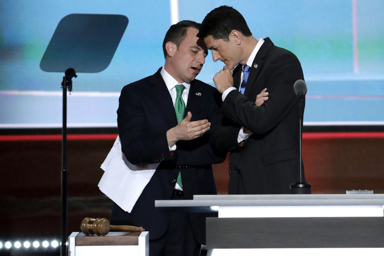 Paul Ryan and Reince Priebus huddle at the Republican convention in Cleveland in July. (J. Scott Applewhite/AP)</p>  