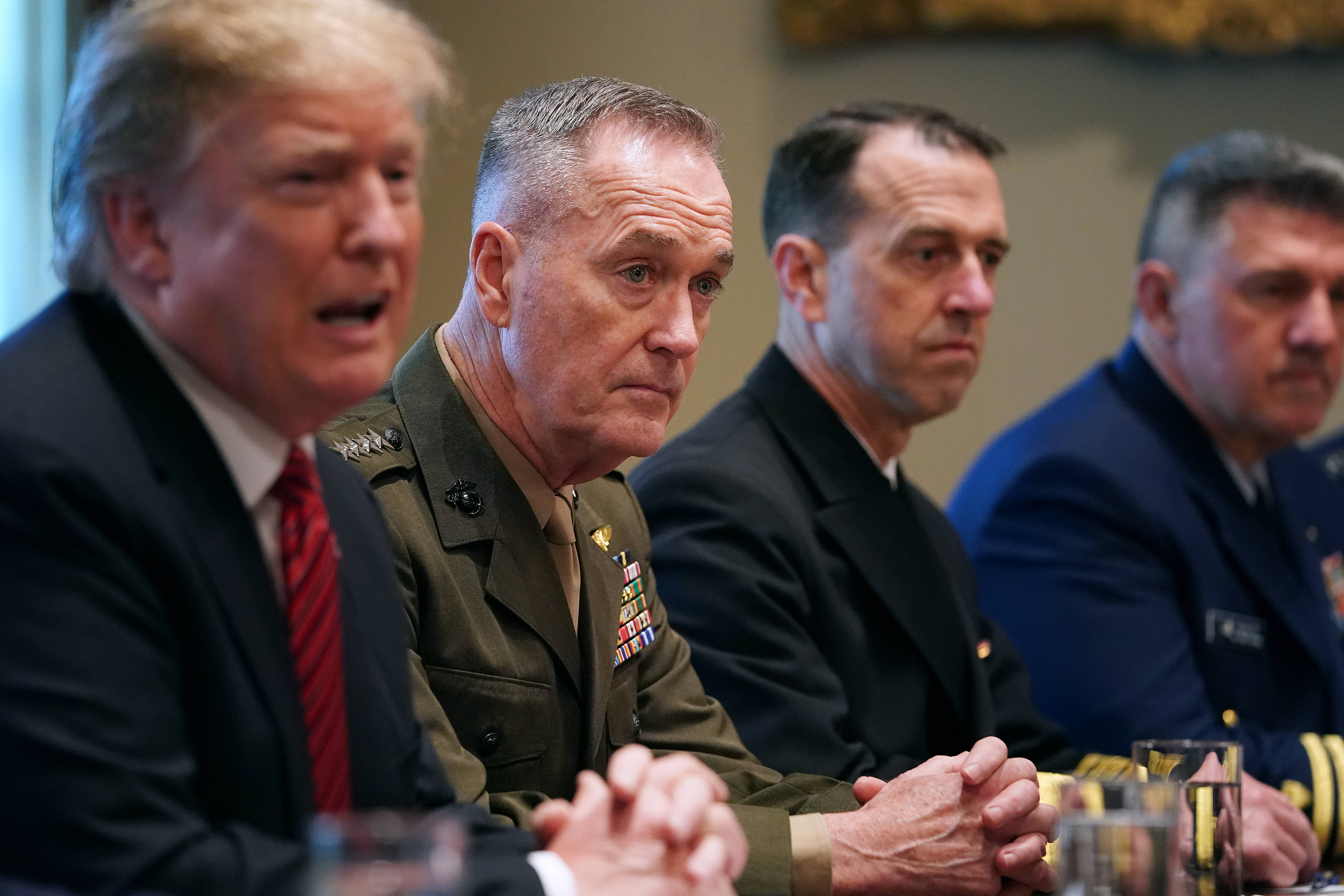 Trump talks with reporters alongside military leaders in 2019. (Chip Somodevilla/Getty Images)
