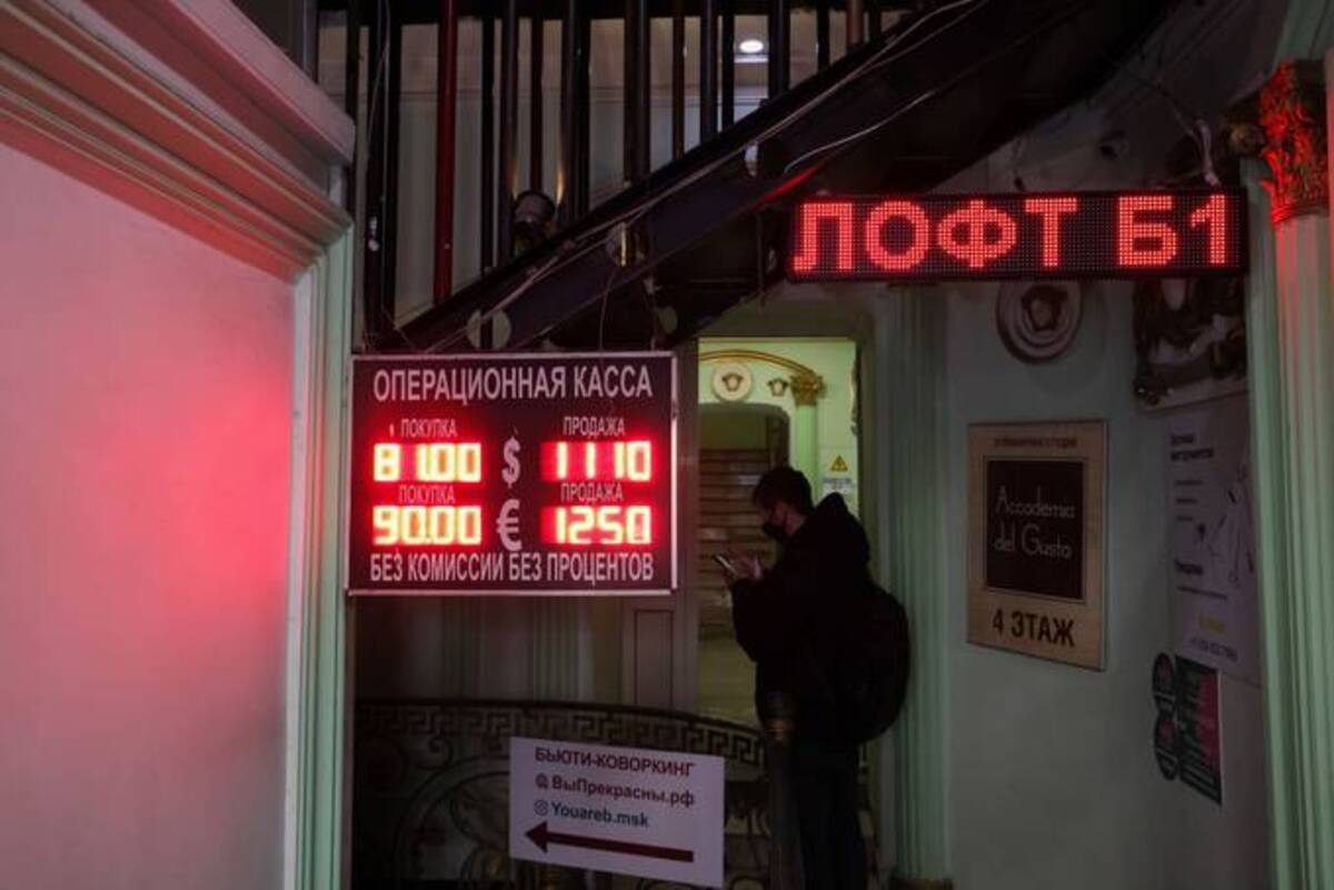 A sign displays foreign currency exchange rates to the Russian ruble at an exchange bureau in Moscow on Monday. (Andrey Rudakov/Bloomberg News)