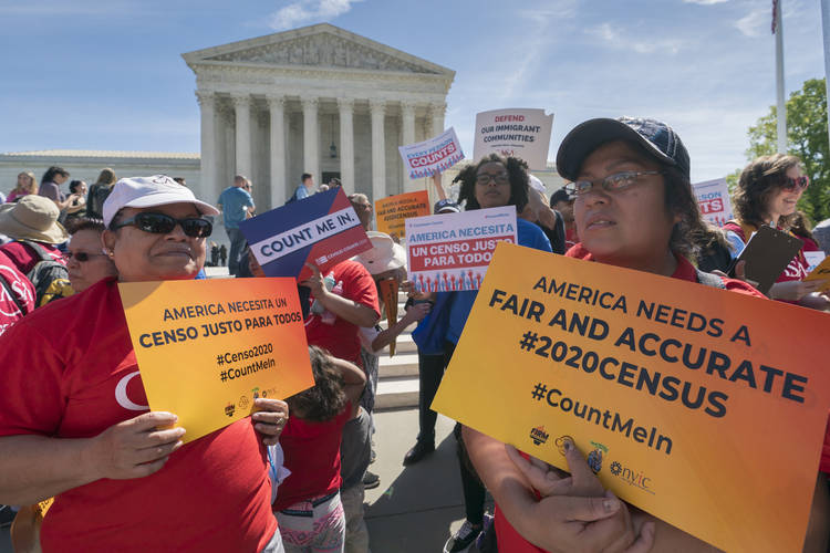 Immigration activists rally outside the Supreme Court as the justices hear arguments over the Trump administration's plan to ask about citizenship on the 2020 Census. (J. Scott Applewhite/AP)  