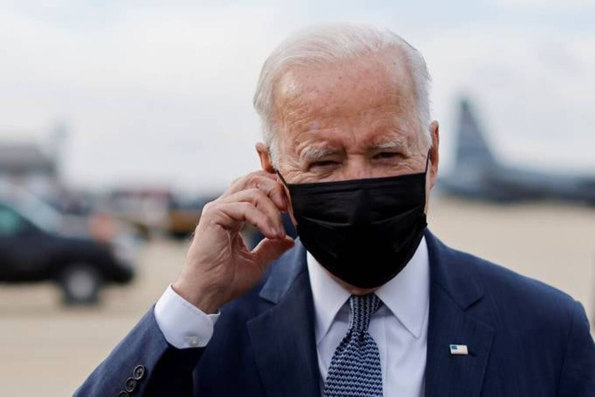 Biden speaks to reporters before departing from the Delaware Air National Guard Base on Monday. (Jonathan Ernst/Reuters)