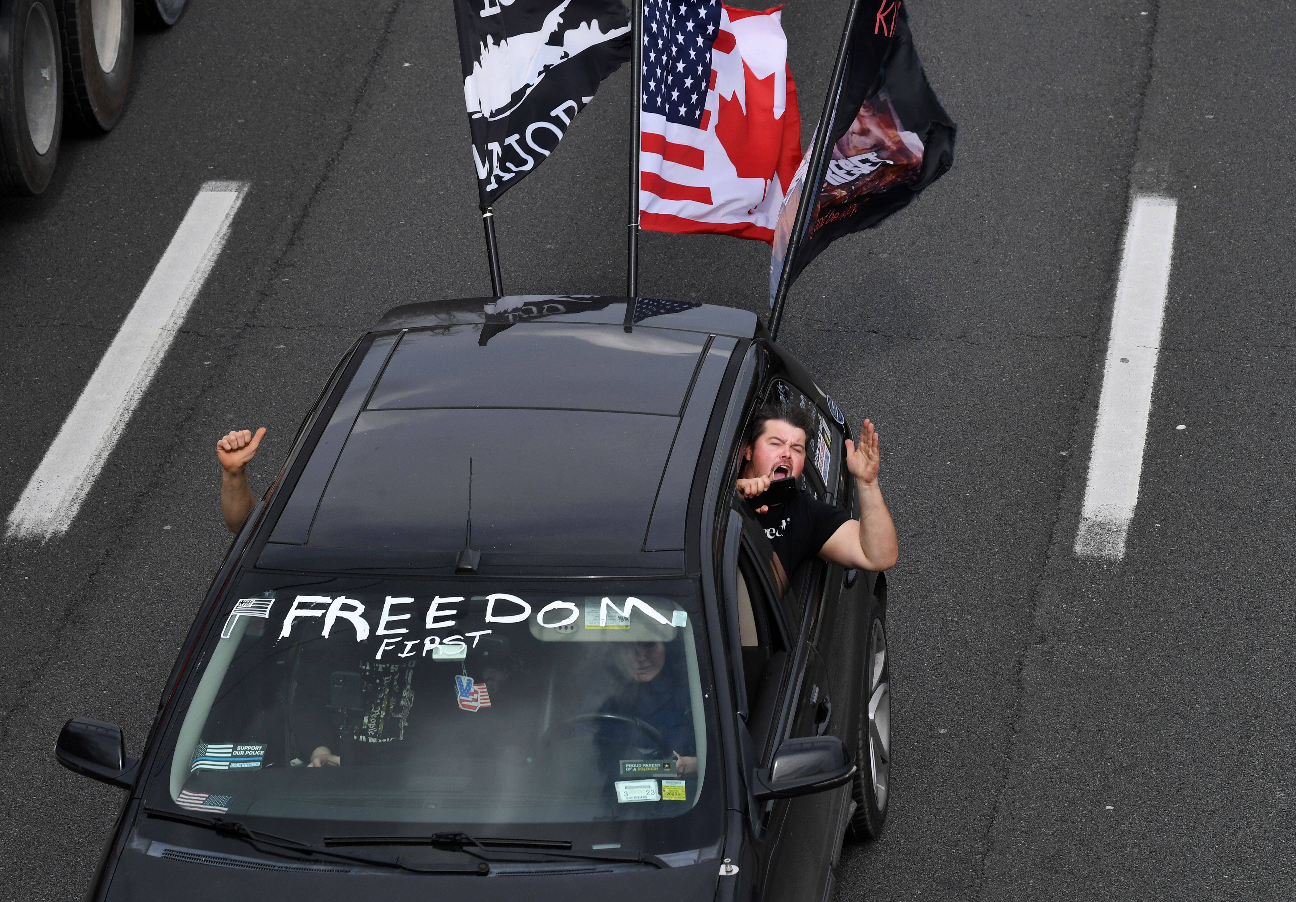 A convoy of trucks makes its way along Interstate 495 South on March 7 in McLean, Va. (Matt McClain/The Washington Post)