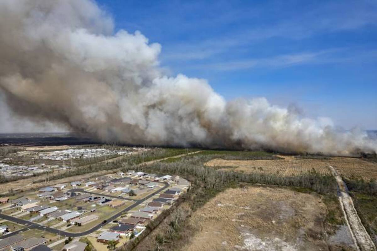 A wildfire near homes outside Panama City, Fla., on March 4. (Mike Fender/News Herald/AP)