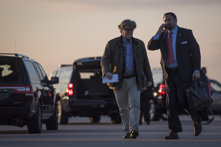 Stephen Bannon and Jason Miller, the communications director of the Trump transition team, disembark from Trump's plane in Hebron, Ky., earlier this month. (Jabin Botsford/The Washington Post)</p>  