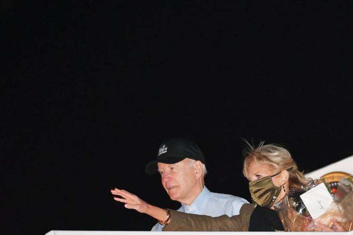 Biden and first lady Jill Biden make their way to board Air Force One before departing from Andrews Air Force Base in Maryland on Nov. 23, 2021. (Mandel Ngan/AFP)&nbsp;