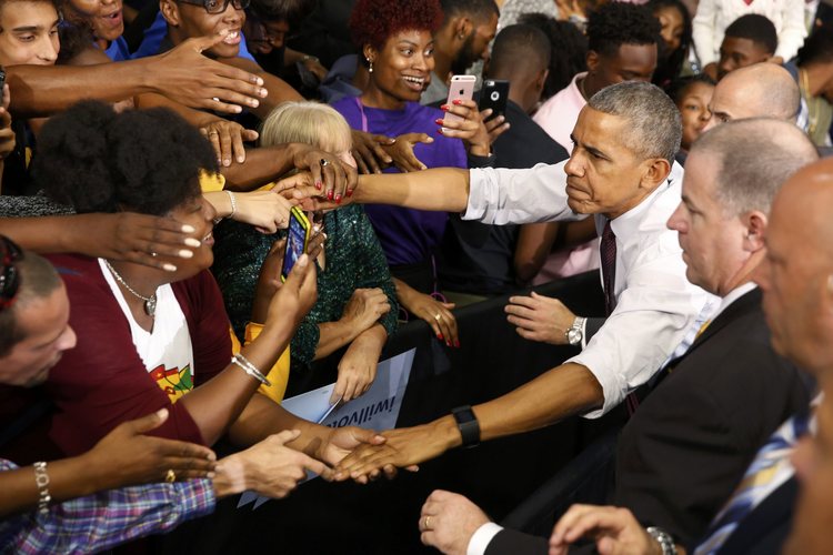 President Obama works the ropeline after his speech at Fayetteville State University in North Carolina yesterday. (Jonathan Ernst/Reuters)</p>  