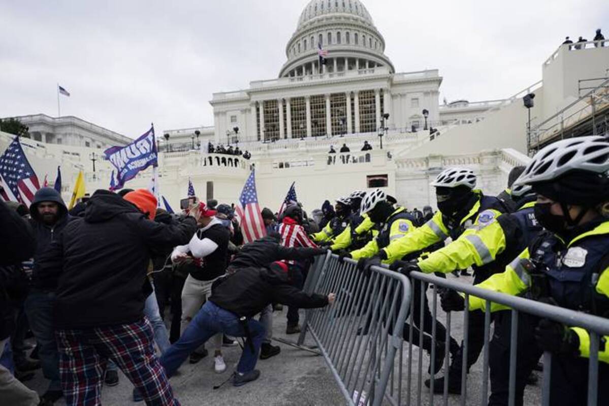 Insurrectionists loyal to President Donald Trump try to break through a police barrier at the Capitol in Washington on Jan. 6, 2021. (Julio Cortez/AP)