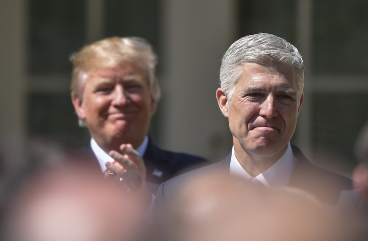 Trump applauds Neil Gorsuch at his swearing-in ceremony. (Ricky Carioti/The Washington Post)</p>