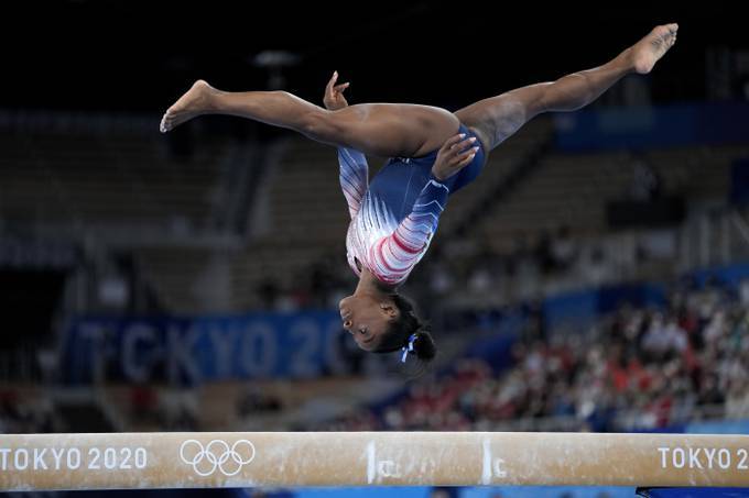 Simone Biles performs on the balance beam at the Tokyo Olympics. (Ashley Landis/AP)