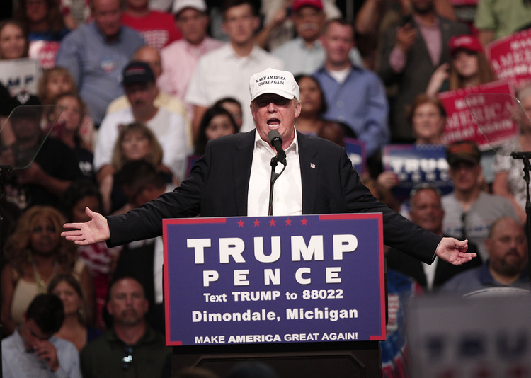 Trump rallies in Dimondale, Michigan, on Friday night.&nbsp;(Bill Pugliano/Getty Images)</p>  