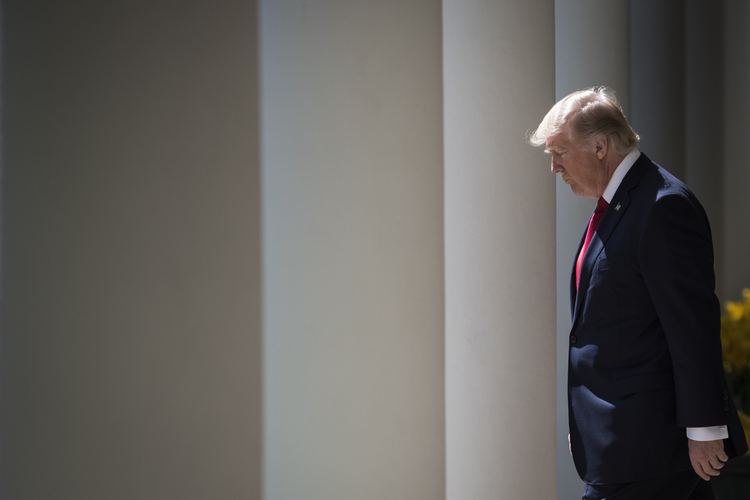 President Trump walks the grounds of the White House yesterday. (Jabin Botsford/The Washington Post)</p>