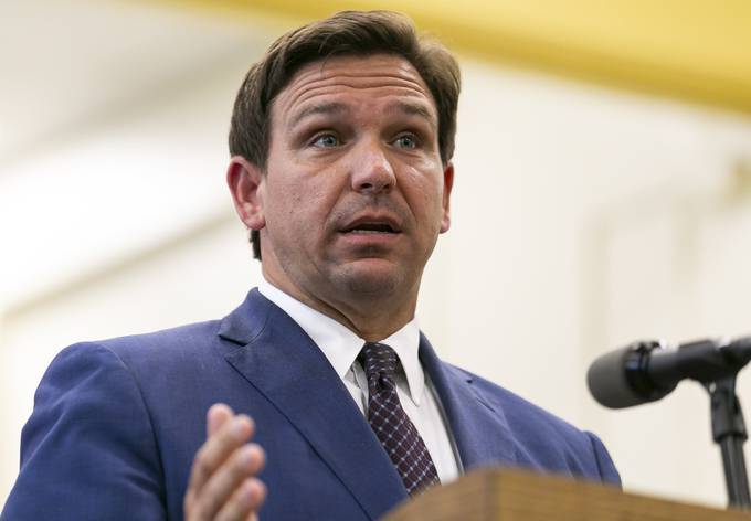 Florida Gov. Ron DeSantis (R) has flouted mask mandates and touted keeping the economy open even as coronavirus cases in his state start to clumb. (Matias J. Ocner/Miami Herald via AP, File)