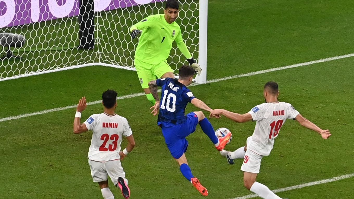 USA's forward Christian Pulisic scores his team's first goal past Iran's goalkeeper Alireza Beiranvand at the Al-Thumama Stadium in Doha on Nov 29. (Odd Andersen/AFP via Getty Images)