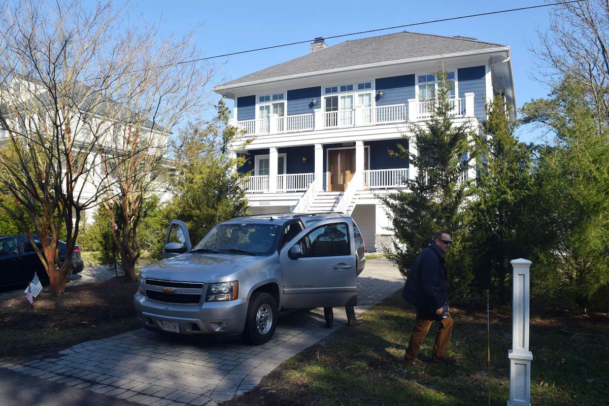 Secret Service agents are seen in front of President Biden's Rehoboth, Del., home in 2021. (Shannon Mcnaught/AP)