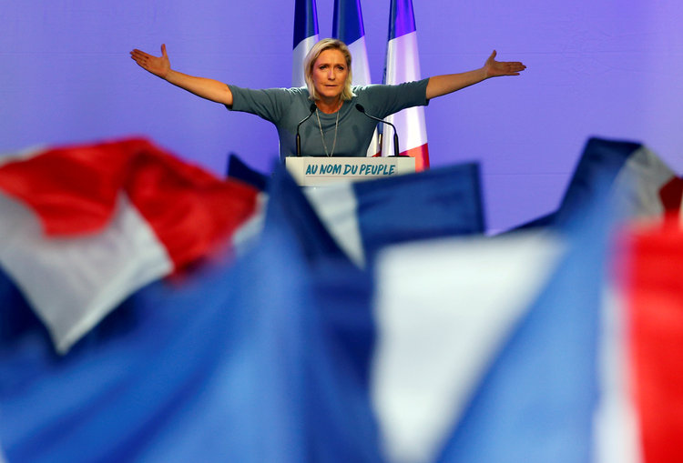 Marine Le Pen, the leader of the French National Front party, speaks at a rally in September. (Jean-Paul Pelissier/Reuters)</p>  