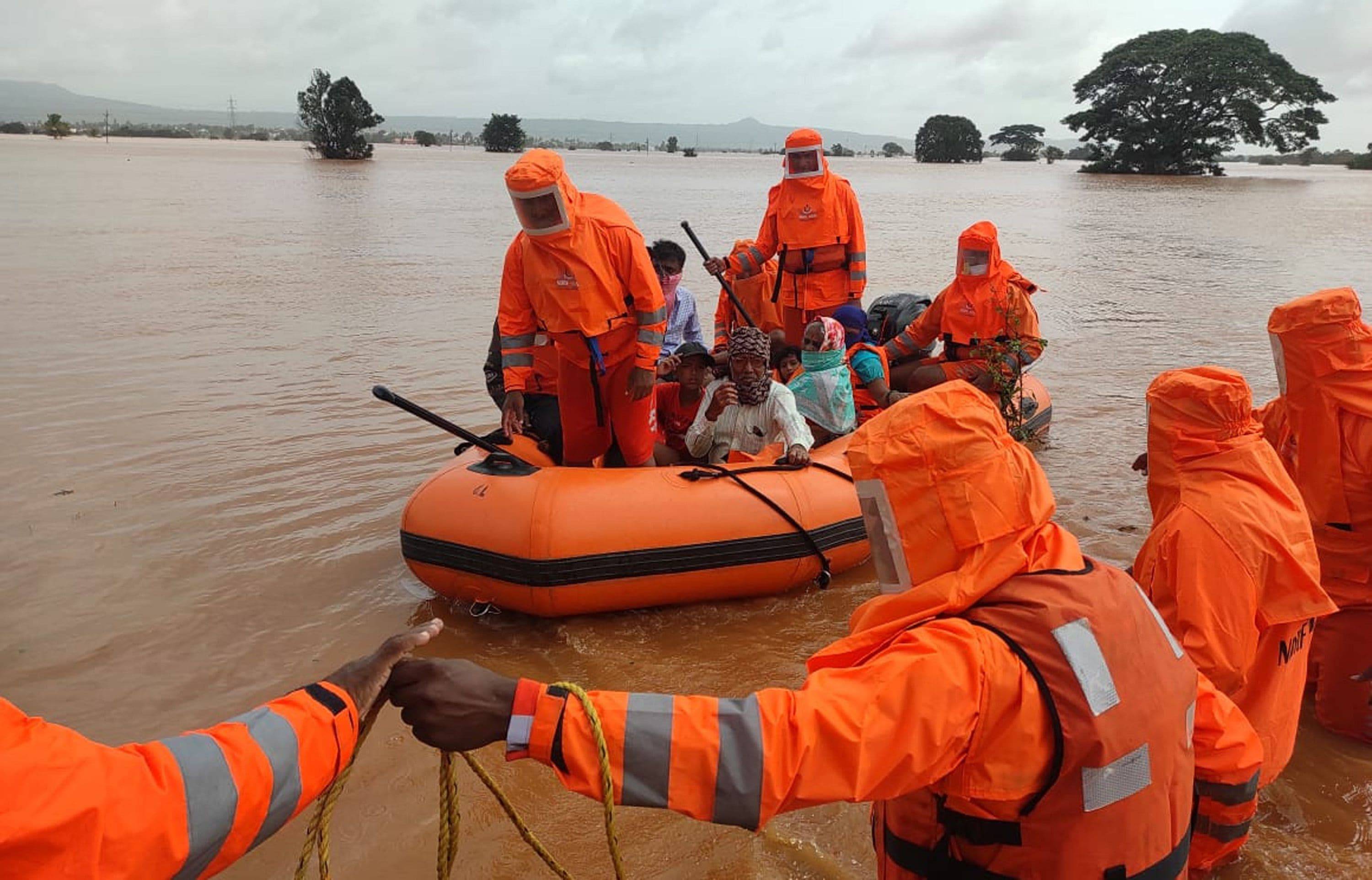 Disaster response teams rescuing stranded villagers from floods in India on Sunday. (National Disaster Response Force/EPA-EFE/Shutterstock)&nbsp;
