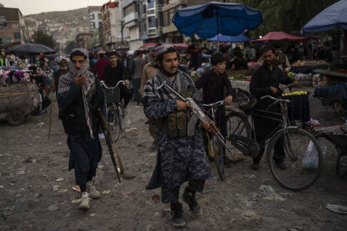 Taliban fighters patrol a market in Kabul's Old City, Afghanistan, Tuesday, Sept. 14, 2021. (AP Photo/Bernat Armangue)