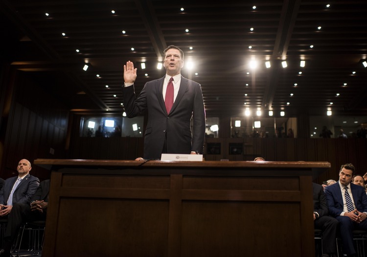 James Comey&nbsp;swears to tell the truth before the Senate Intelligence Committee yesterday. (Melina Mara/The Washington Post)</p>  