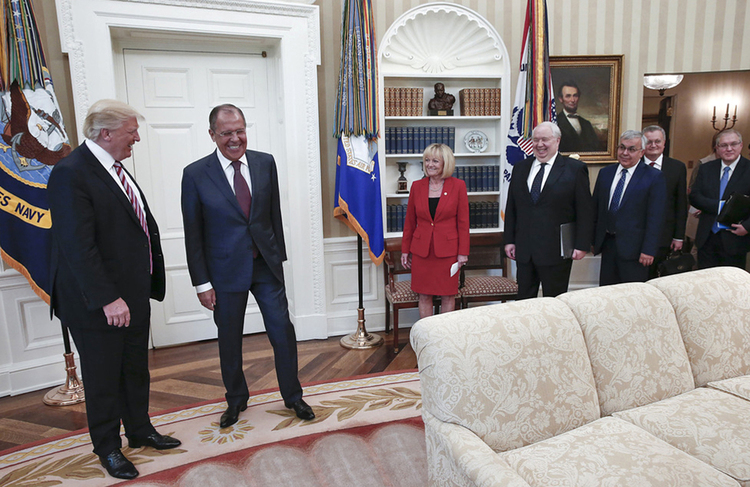 Donald Trump huddles with Sergey Lavrov, Vladimir Putin's top diplomat,&nbsp;at the White House last Wednesday. Fourth from the right is Russian Ambassador Sergei Kislyak. (Handout from the Russian Foreign Ministry Photo/Via AP)</p>  
