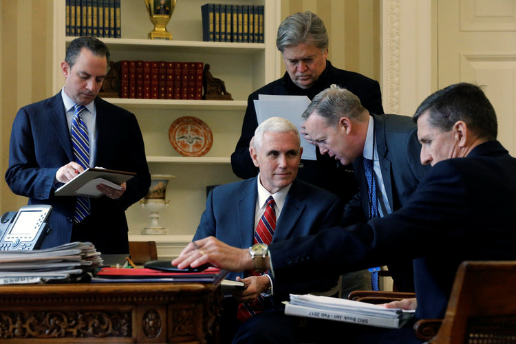 Reince Priebus, Mike Pence, Steve Bannon, Sean Spicer and Michael Flynn listen as President Trump speaks by phone with Vladimir Putin in the Oval Office on Jan. 28. (Jonathan Ernst/Reuters)</p>