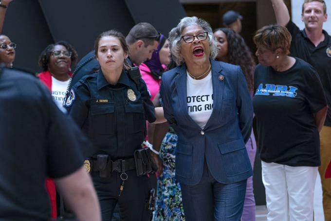 Rep. Joyce Beatty (D-Ohio) is taken into custody by U.S. Capitol Police officers in the Hart Senate Office Building, after a demonstration supporting the voting rights. (Jose Luis Magana/AP)